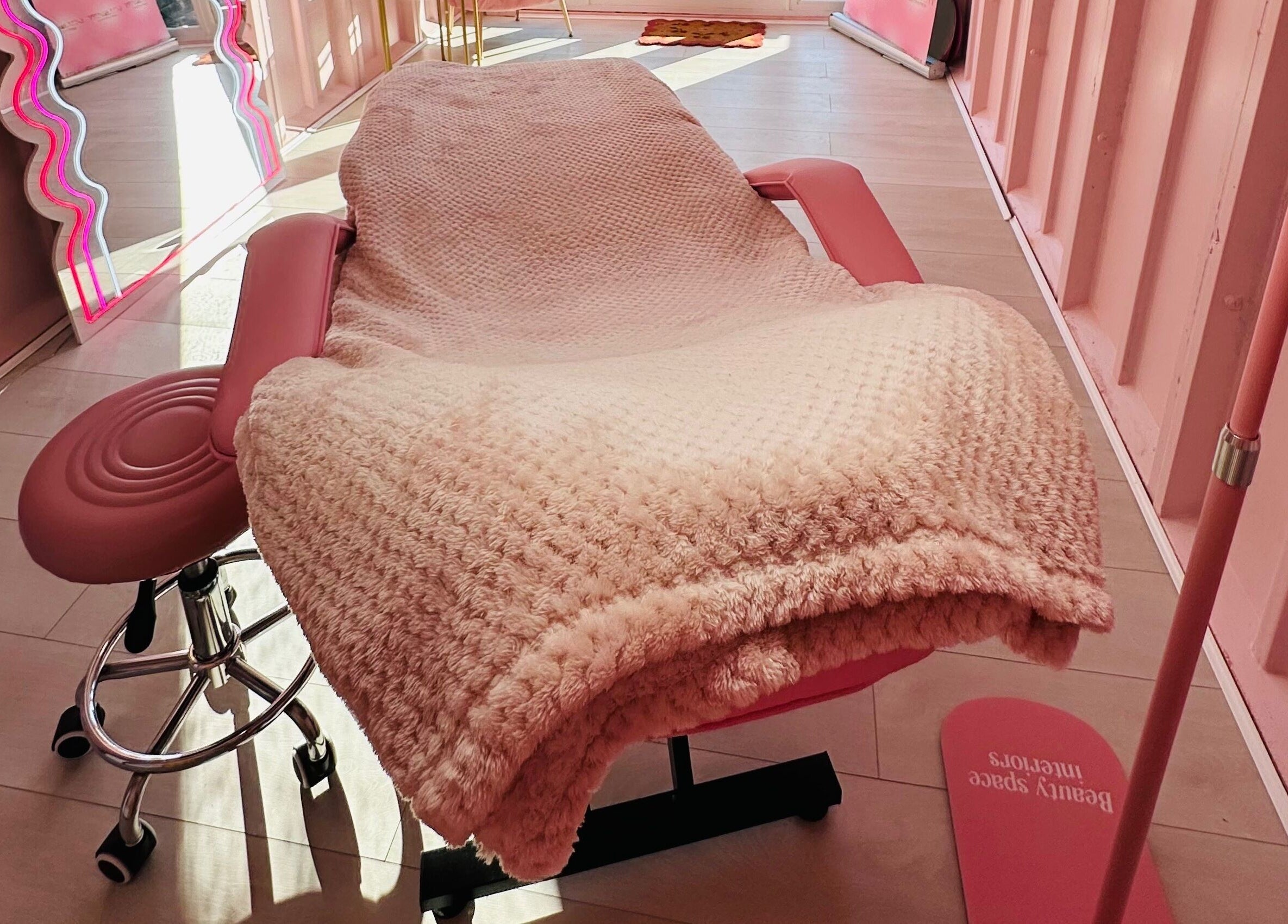 Luxurious pink treatment room at Doll Beauty Aesthetics & Training Academy, Cleeve, England, GB.
