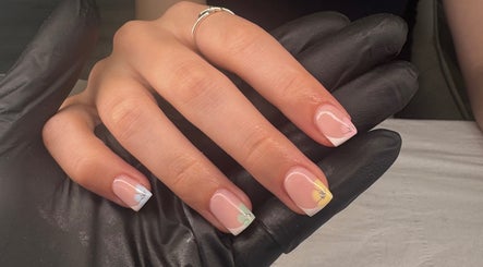 Elegant nail art with floral accents at Dolly’s Beauty Bar, Newhall, England, GB.