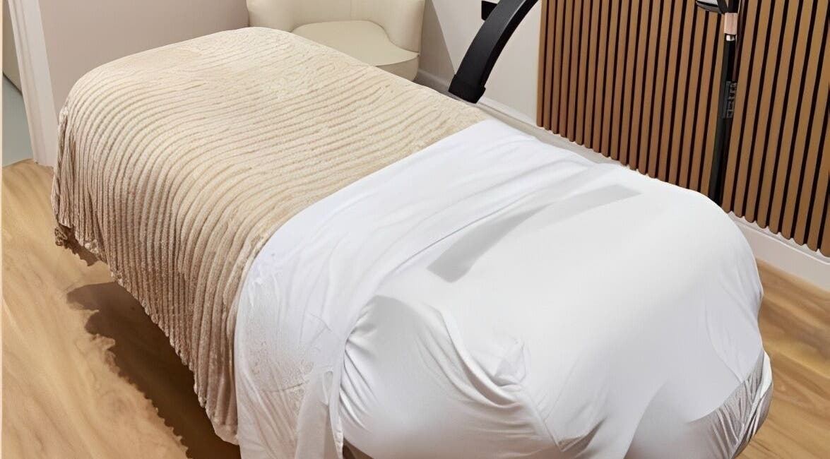 Relaxing treatment bed at Naked Beauty, North Weald Bassett, GB offering luxurious wellness experiences.