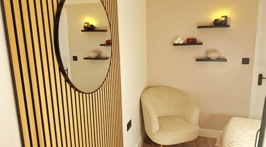 Cozy relaxation corner at Naked Beauty, North Weald Bassett, GB, featuring elegant decor and warm lighting.