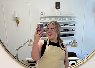 Friendly staff at Nails by Leah Rose in Dinnington, England, GB, reflected in a salon mirror.