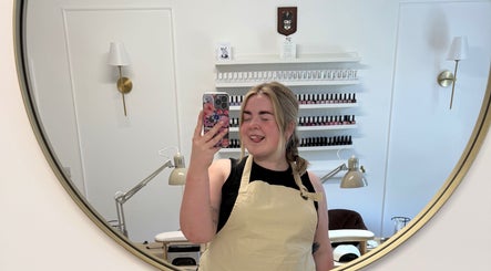 Friendly staff at Nails by Leah Rose in Dinnington, England, GB, reflected in a salon mirror.