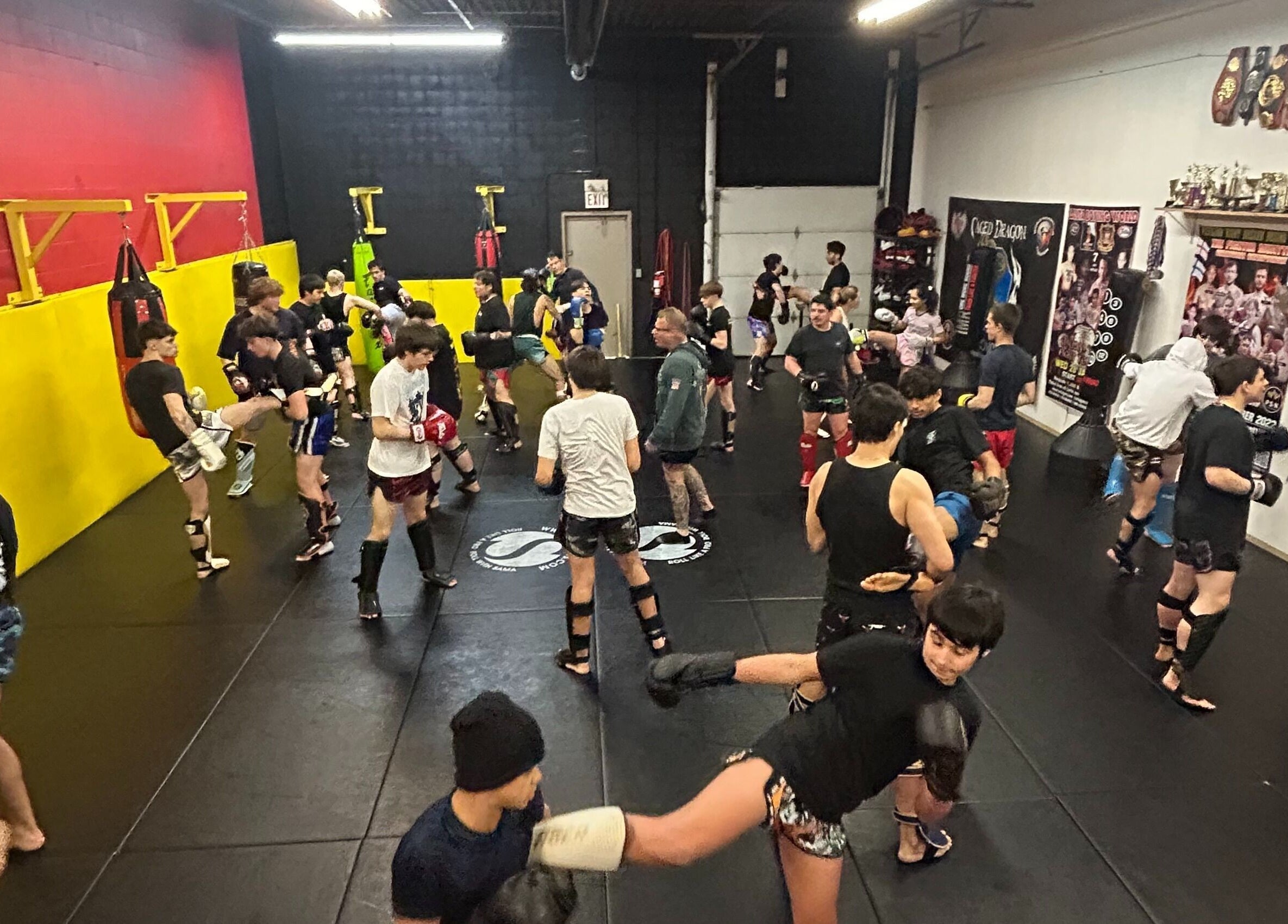 Active Private Muay Thai Sessions at Brantford, Ontario, CA featuring groups practicing kicks and punches.