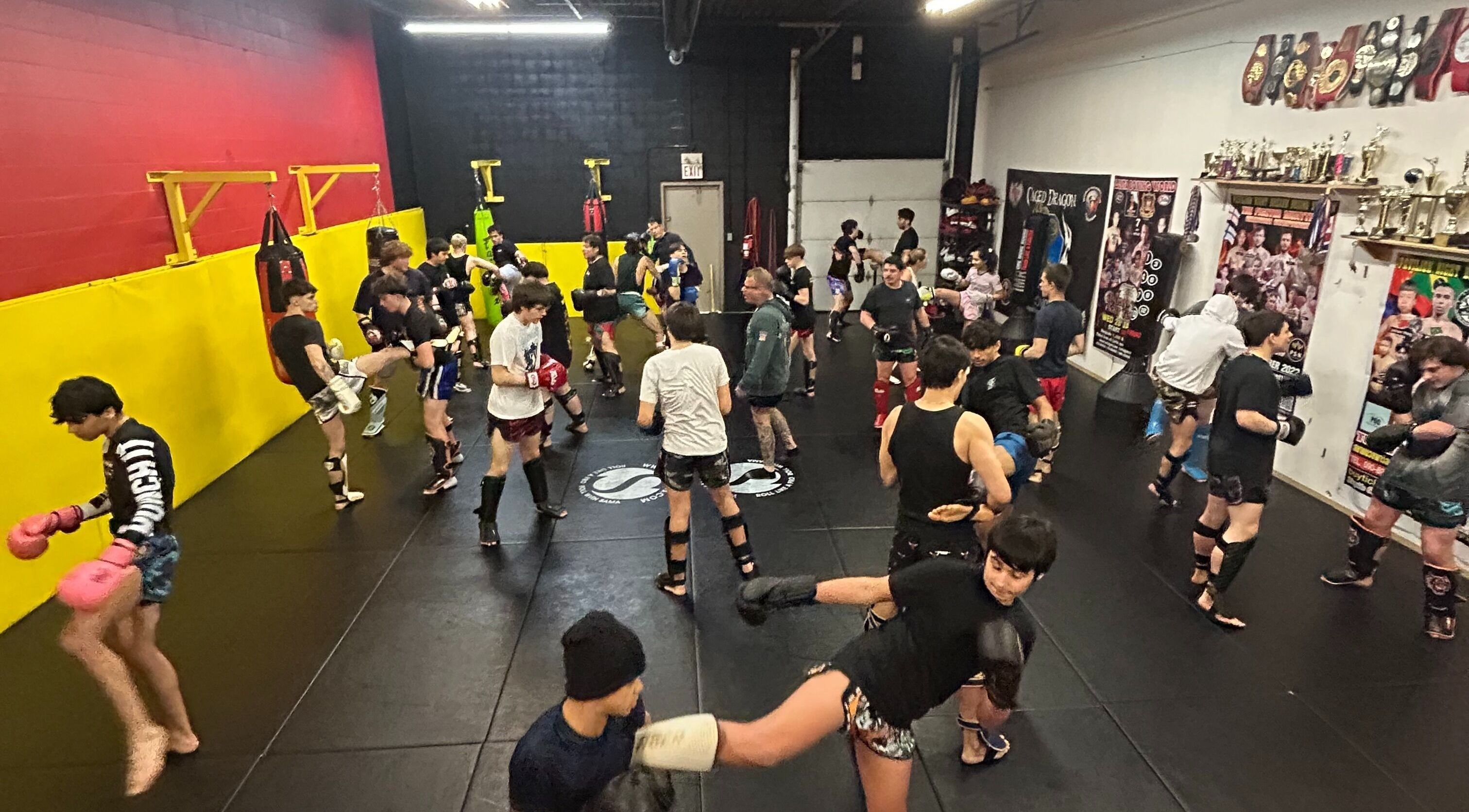 Active Private Muay Thai Sessions at Brantford, Ontario, CA featuring groups practicing kicks and punches.
