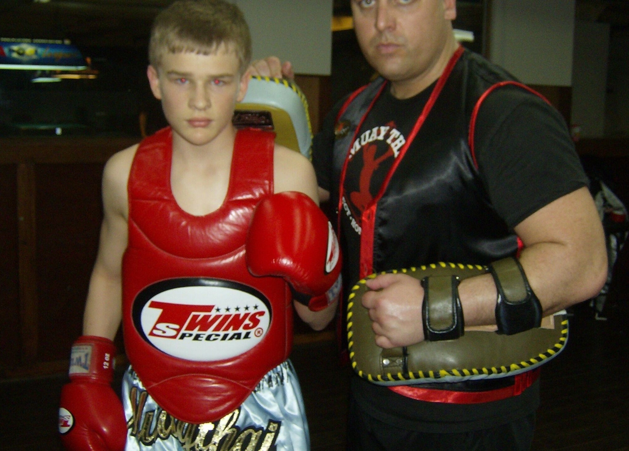 Two fighters during Private Muay Thai Sessions in Brantford, Ontario, CA, showcasing gear and training.