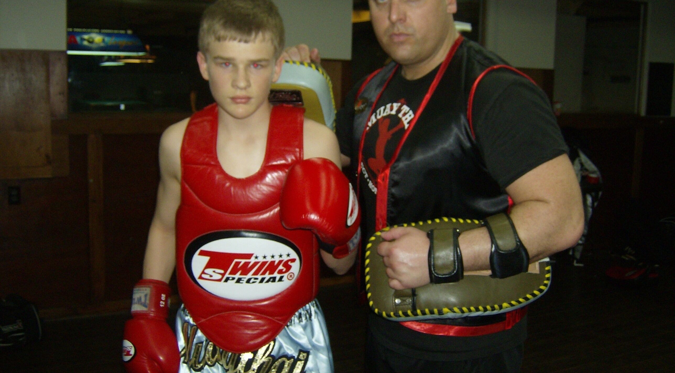 Two fighters during Private Muay Thai Sessions in Brantford, Ontario, CA, showcasing gear and training.