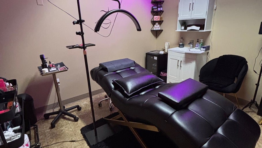 Relaxing treatment room at NC Beauty Bar, LLC in Milwaukee, Wisconsin, US featuring a plush massage table.
