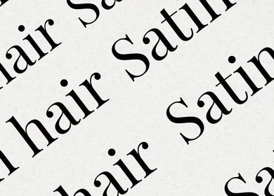 Repetitive script of 'Satin hair' showcasing Satinhairldn branding in London, England, GB.