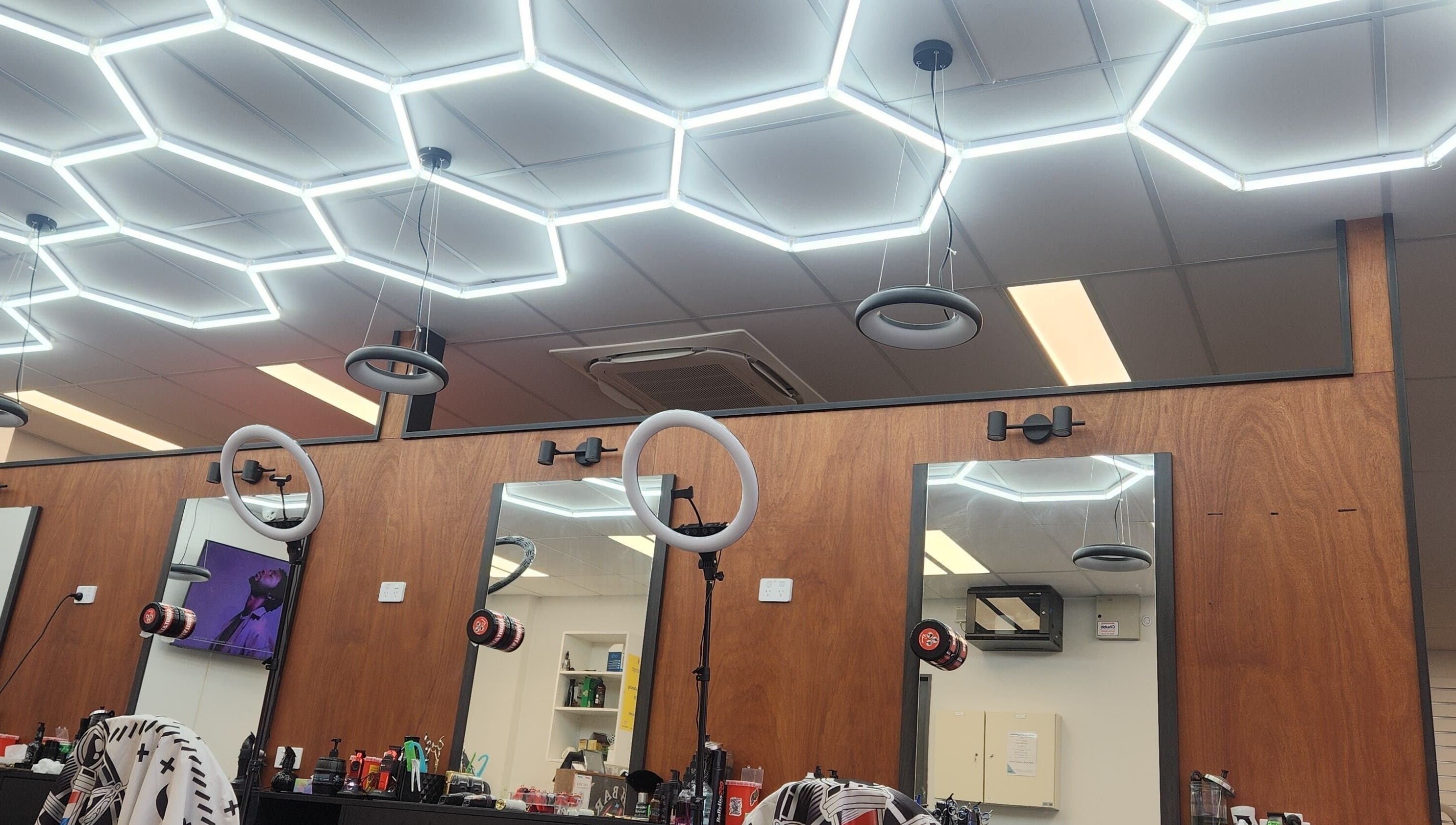 Modern salon setup at Fresh barber cuts in Christchurch, Canterbury Region, NZ with sleek lighting design.