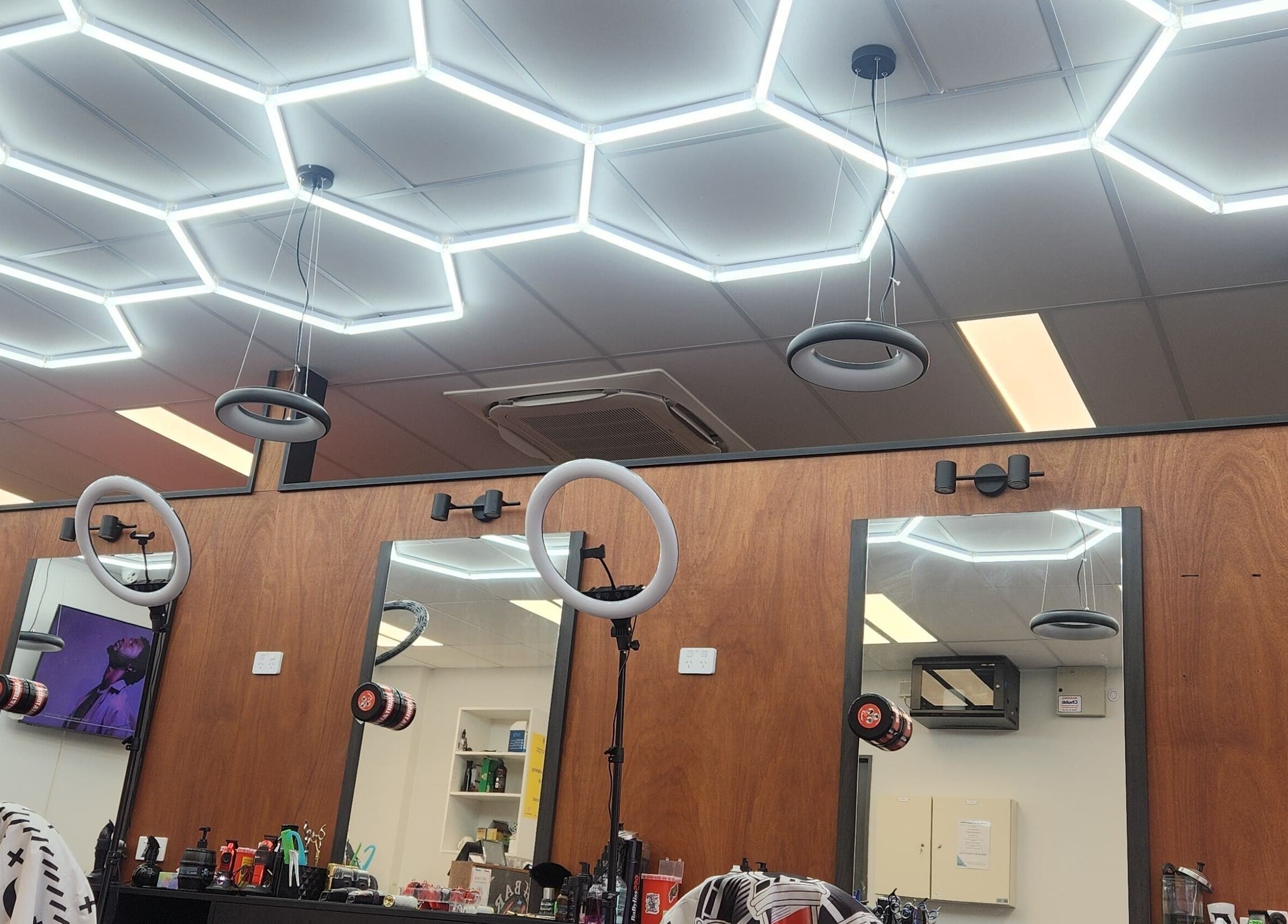 Modern salon setup at Fresh barber cuts in Christchurch, Canterbury Region, NZ with sleek lighting design.