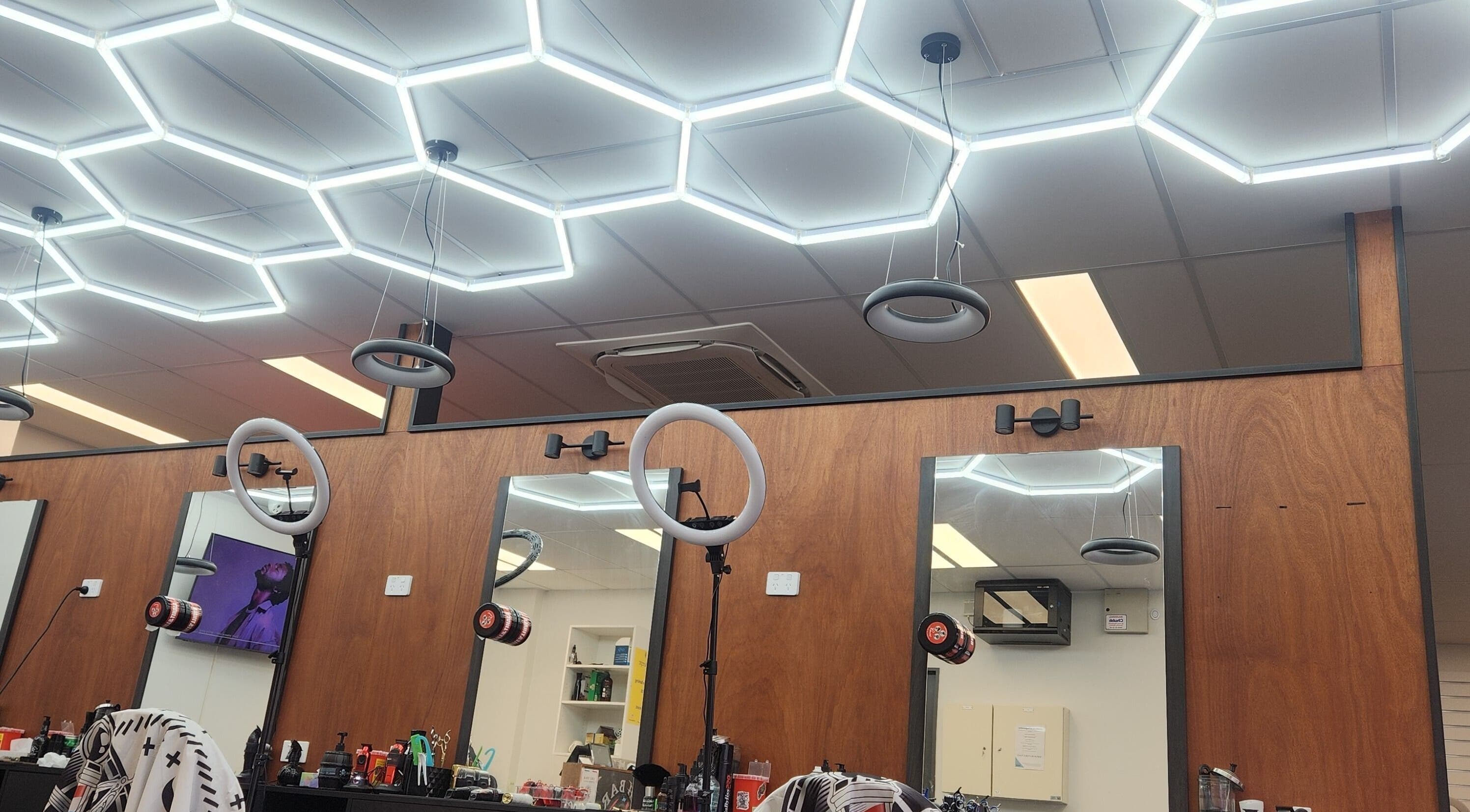 Modern salon setup at Fresh barber cuts in Christchurch, Canterbury Region, NZ with sleek lighting design.