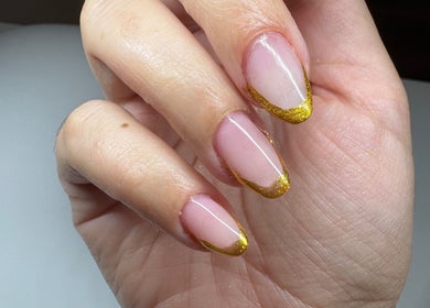 Elegant golden-tipped manicure at Nails By Joy, Winter Garden, Florida, US.