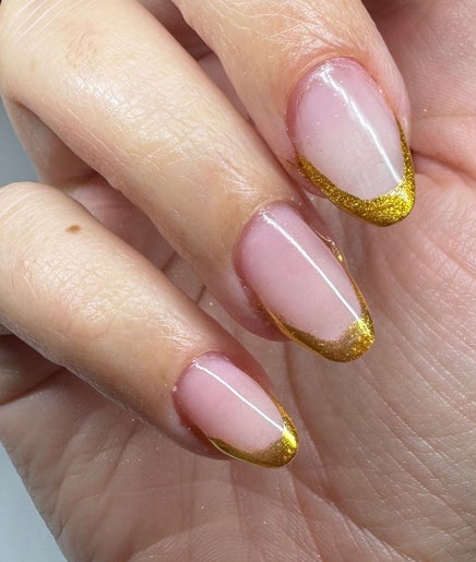 Elegant golden-tipped manicure at Nails By Joy, Winter Garden, Florida, US.