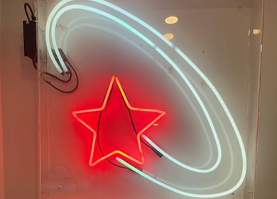 Neon star sign glowing at Danielle @ HEADS, Toronto, Ontario, CA, creating a vibrant atmosphere.