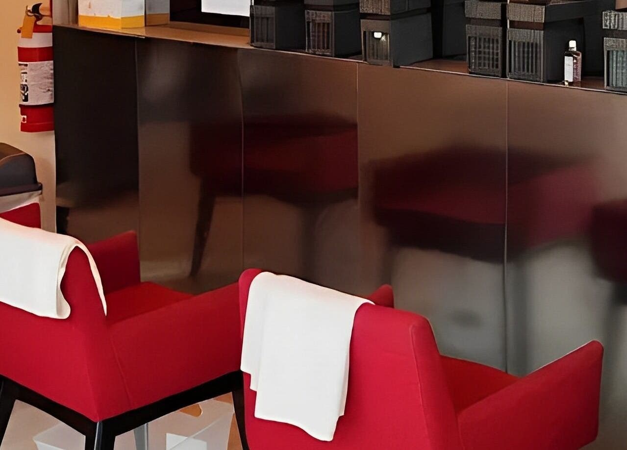 Modern red chairs at Zen5 - Chinese Remedial Massage in Melbourne, Victoria, AU, offering a serene ambiance.