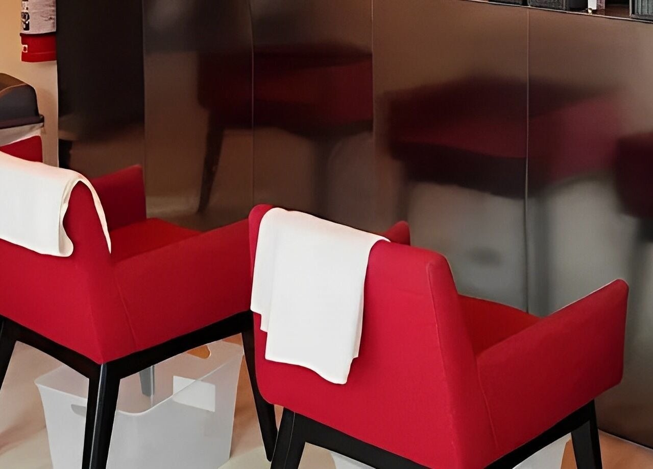 Modern red chairs at Zen5 Little Collins St, Melbourne for a calming massage experience.