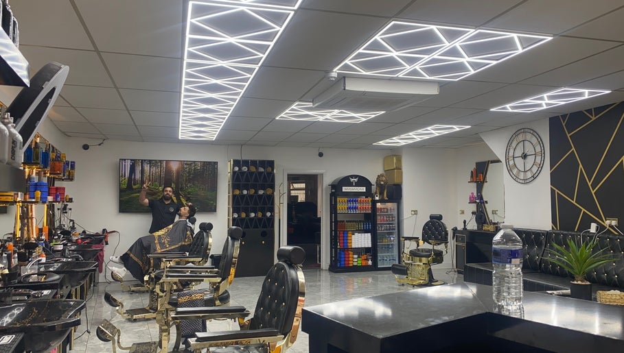 Modern interior of Sean’s Chair salon in Sheerness, England, GB, featuring stylish decor and barber chairs.