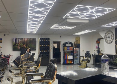 Modern interior of Sean’s Chair salon in Sheerness, England, GB, featuring stylish decor and barber chairs.