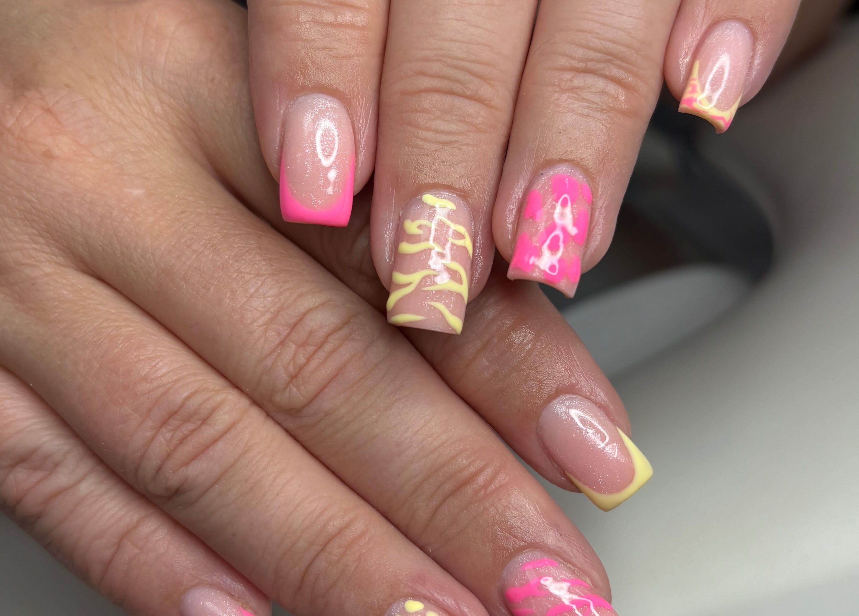 Vibrant neon nail art at TILLYnailedit, Chadderton, England, GB. Bright colors and intricate designs.