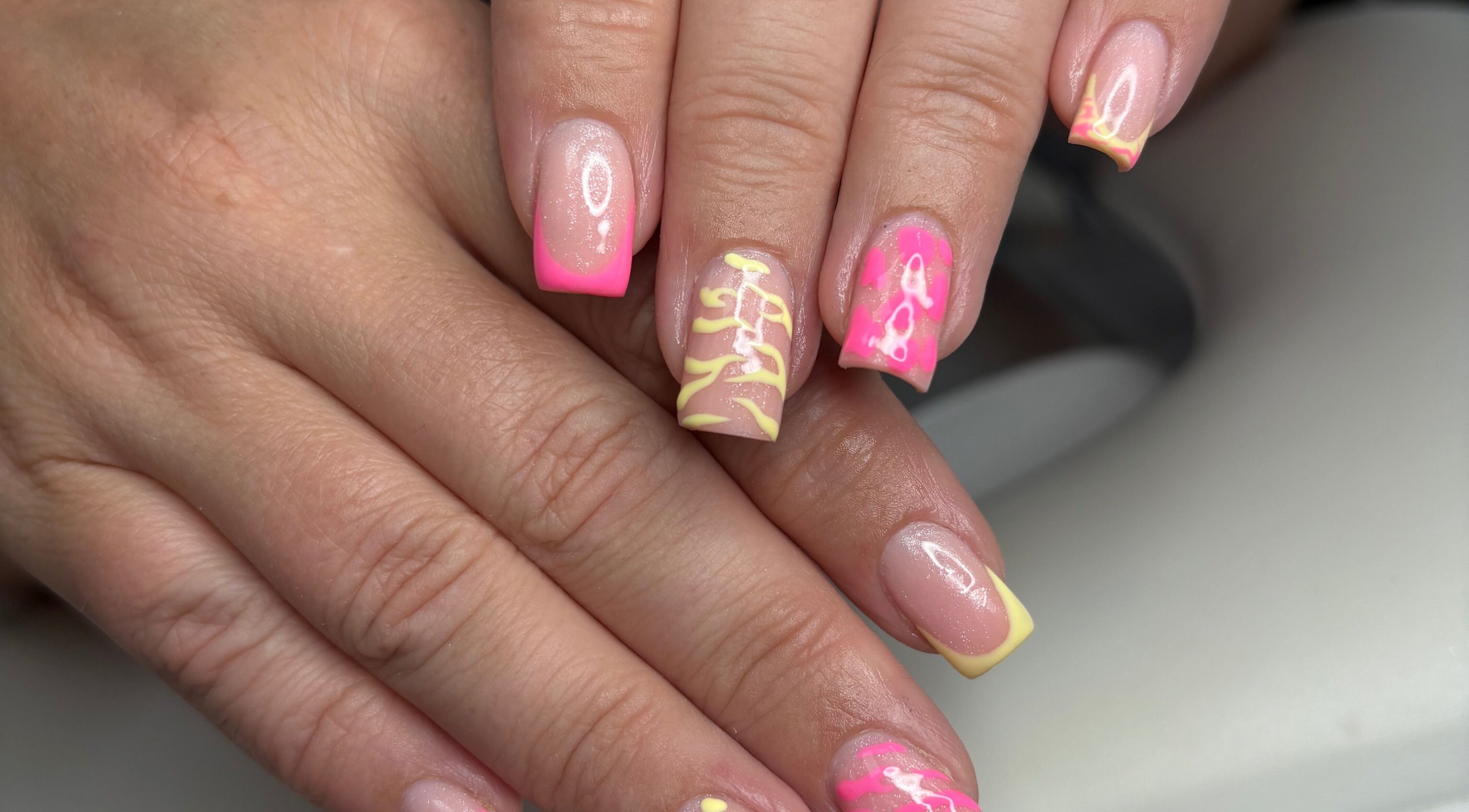 Vibrant neon nail art at TILLYnailedit, Chadderton, England, GB. Bright colors and intricate designs.