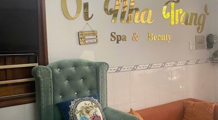 Elegant seating at Oi Nha Trang Spa & Beauty in Nha Trang, Khánh Hòa, VN features chic green chair and cozy decor.