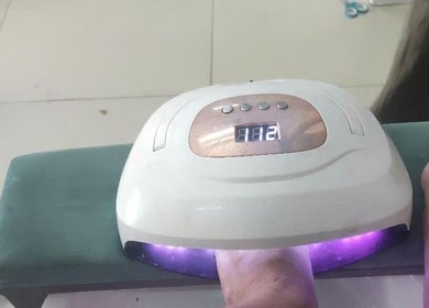 Gel nail curing under UV light at Oi Nha Trang Spa, Nha Trang, Khánh Hòa, VN for a flawless finish.
