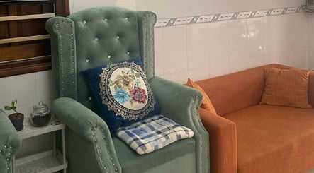 Elegant seating area at Oi Nha Trang Spa, Nha Trang, Khánh Hòa, VN, featuring plush chairs and cushions.