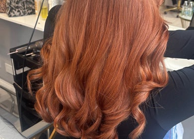 Luxurious copper hair curls styled at Levre Beauty, London, England, GB salon.