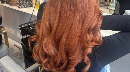 Luxurious copper hair curls styled at Levre Beauty, London, England, GB salon.