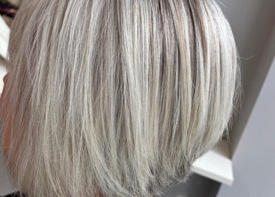 A sleek silver bob hairstyle at Levre Beauty, London, England, GB, showcasing modern elegance.