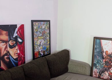 Stylish superhero-themed wall art at Slim Fadey barbershop, Melbourne, Victoria, AU. Creative decor for a unique vibe.