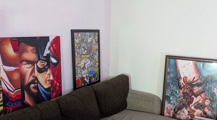 Stylish superhero-themed wall art at Slim Fadey barbershop, Melbourne, Victoria, AU. Creative decor for a unique vibe.