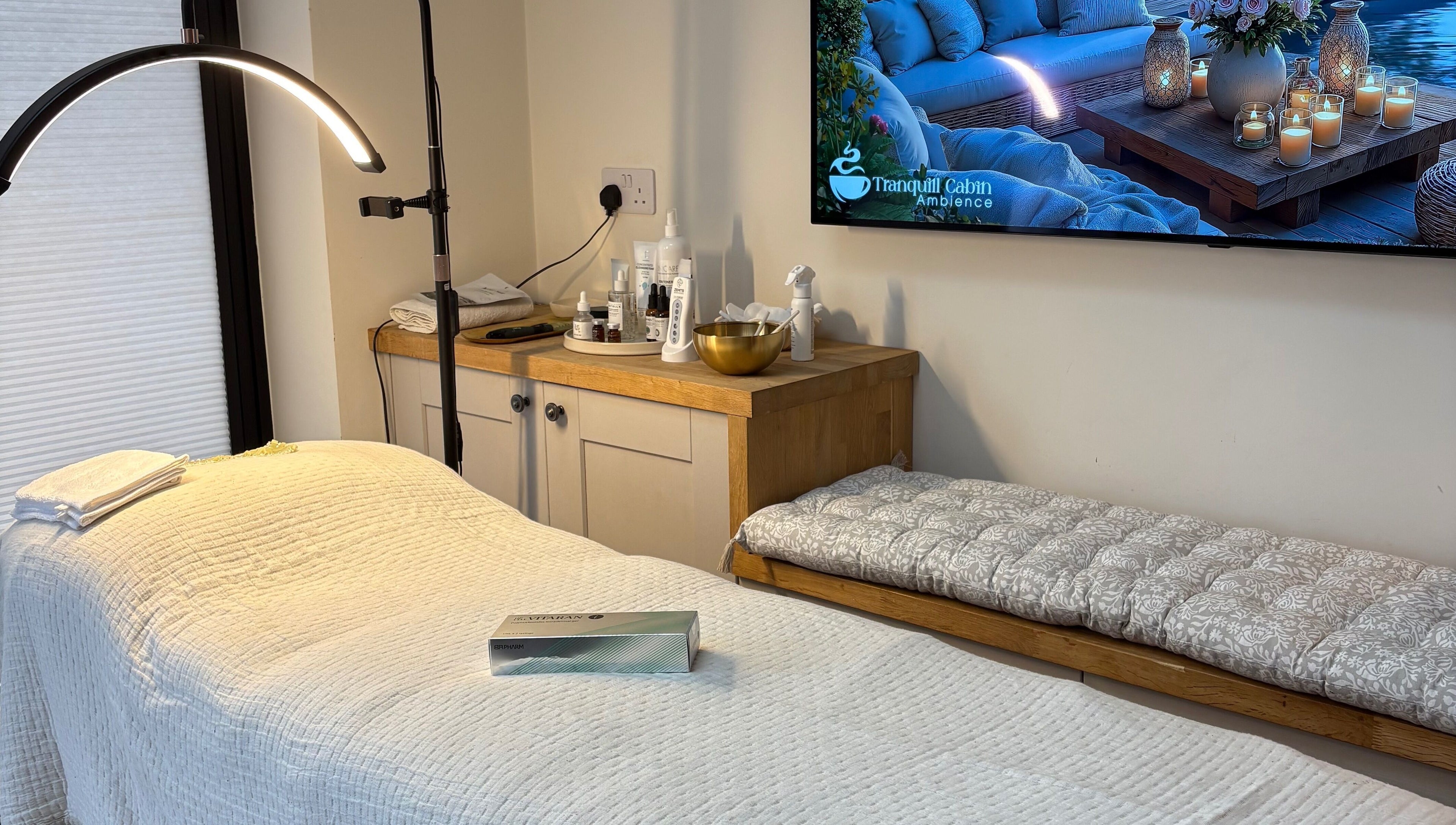 Cozy treatment room at Glow by Mykala, Carlton, England, GB, with a massage bed and soft ambient lighting.