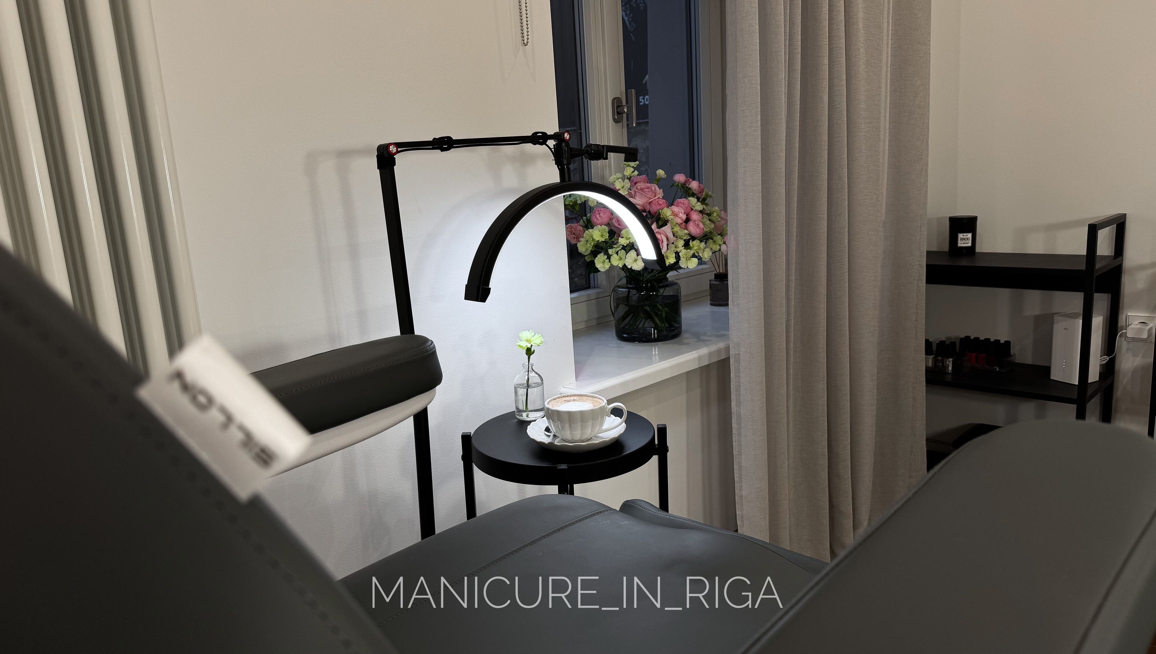 Cozy manicure setup at Manicure in Riga, Rīga, LV with flowers and coffee.