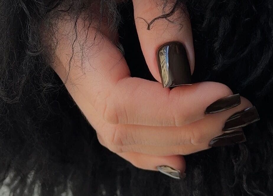 Elegant dark manicure in Riga with sleek black nails, located at Rīga, LV.