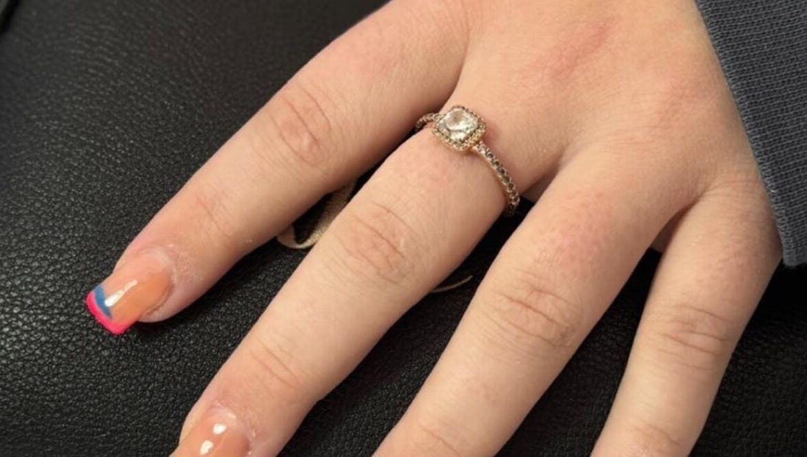 Colorful manicured nails with a ring at Niamh&Co, Stanford-le-Hope, England, GB.