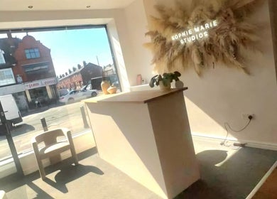 Inviting reception at Hindle Luxx Aesthetics, Manchester with bright decor and natural light.