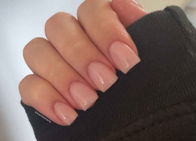 Manicured hand with soft pink nails by Lustrée Nails, Northampton, England, GB.