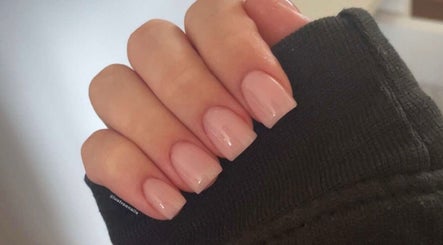 Manicured hand with soft pink nails by Lustrée Nails, Northampton, England, GB.