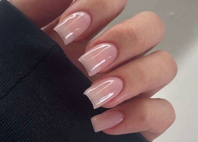 Glossy manicured nails at Lustrée Nails in Northampton, England, GB, showcasing sophisticated nail art.