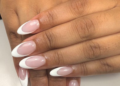 Stylish French manicure at Lustrée Nails, Northampton, England, GB. Perfectly polished elegance.
