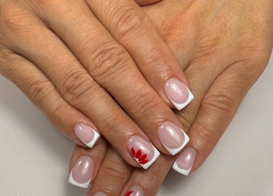 Elegant French manicure with floral design at Lustrée Nails, Northampton, England, GB.