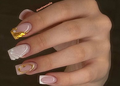 Elegant nail art with gold accents at Lustrée Nails, Northampton, England, GB.