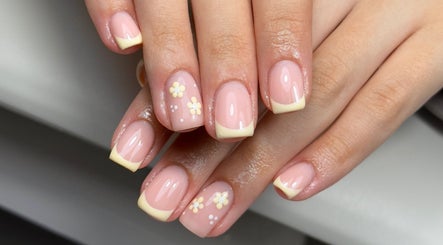 Elegant floral French manicure at Lustrée Nails in Northampton, England, GB.