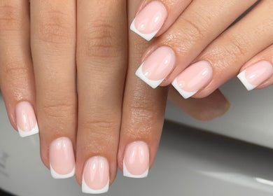 French manicure at Lustrée Nails, Northampton, England, GB. Elegant pink nails with white tips.
