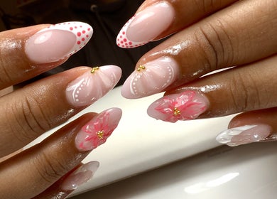 Intricate floral nail art at Lustrée Nails, Northampton, England, GB showcases elegance with pink and white accents.