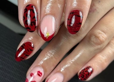 Elegant red and black nail art at Lustrée Nails, Northampton, England, GB.