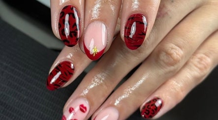 Elegant red and black nail art at Lustrée Nails, Northampton, England, GB.
