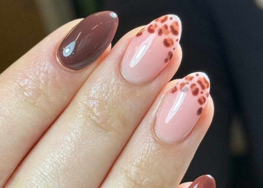 Elegant nail art with brown hues at Lustrée Nails, Northampton, England, GB.