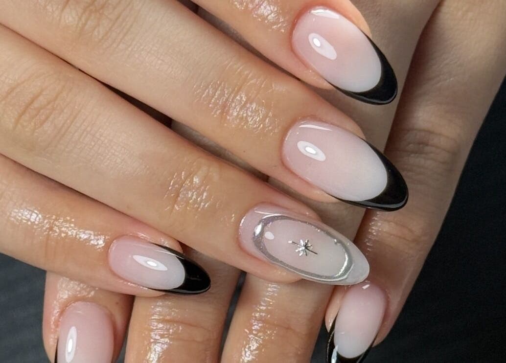 Elegant black-tipped nails from Lustrée Nails in Northampton, England, GB showcase modern nail artistry.